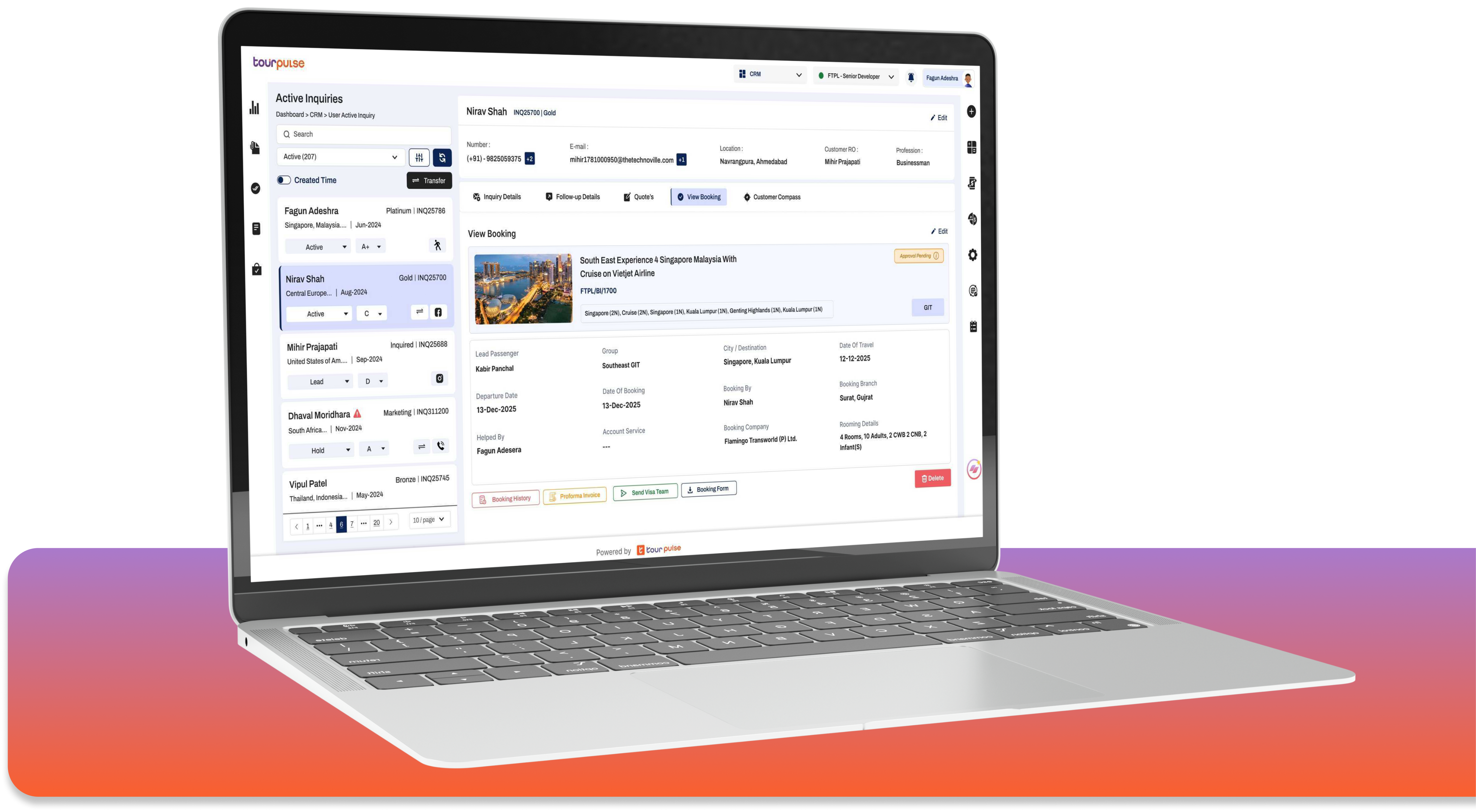Laptop showing a travel booking website with a suitcase, hat, and toy plane next to it